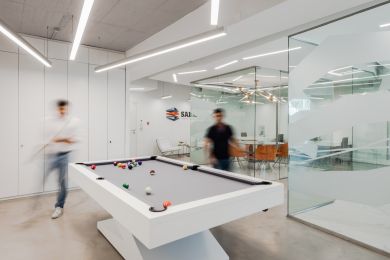 Office colleagues playing billiards